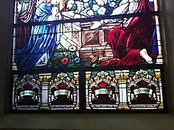 Stained-glass windows from inside Our Lady of Czestochowa Catholic Church in Jersey City, NJ. The bottom stained-glass windows have text in Polish to commemorate the explosion in 1916.