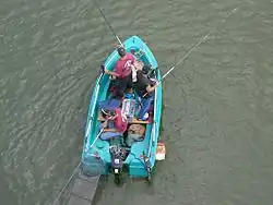 Fishing from a boat on the Doubs, France
