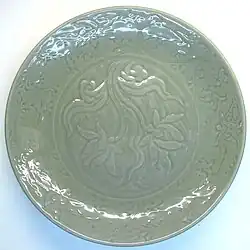 Celadon dish with a flower design