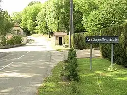 Road sign announcing the entrance in the hamlet of « Chapelle des Buis »