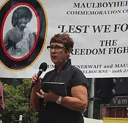 Carolyn Briggs conducting a Welcome to Country ceremony in 2018.
