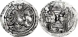 Coin of Peroz in the name of Varahran I.[13] Obverse:' Crowned bust with Sasanian headgear and ram horns; Brahmi “Pi” to right/ Reverse: Fire altar with attendants and ribbons; Brahmi “Nam” in exergue.[14]