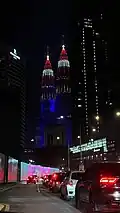 The Petronas Towers illuminated with the colours of the Malaysian flag in Independence day