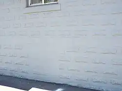 Location of one of the bomb shelter windows of the Charles and Eleanor Abel House which was covered up with cement.