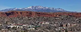A photo of St. George with the Pine Valley Mountains in the background