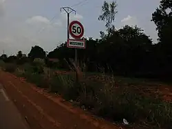 a sign with the village name
