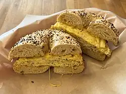 Photograph of a breakfast sandwich cut in half