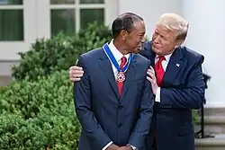 President Donald Trump presents the Medal to Tiger Woods, 2019.