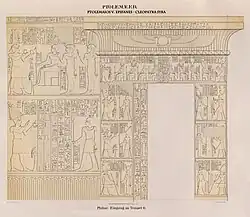 Entrance gate to the temple at Philae; reliefs of Ptolemy V with offerings and a group of gods, at the top left with his wife Cleopatra I Syra and behind her the goddess Ptah-Tatenen