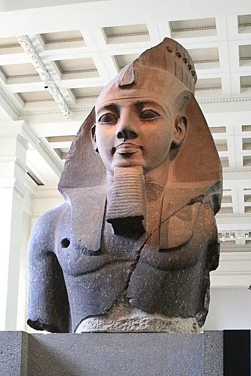 The Younger Memnon (c. 1250 BC), a statue depicting Ramesses II, from the Ramesseum in Luxor (Thebes). Currently on display at the British Museum in London.