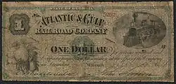 Note inscribed "STATE OF GEORGIA THE ATLANTIC & GULF RAILROAD COMPANY OWES TO ___ OR BEARER ONE DOLLAR for serviced rendered said Company payable on presentation at the office of the Company in Savannah." The note is illustrated with a train and a cotton boll.