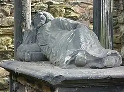 Recumbent figure on the tomb of William and Clement Little, 1683