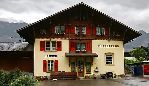 Three-story building with gabled roof