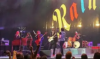Rainbow performing in 2017. (From left to right) keyboardist Jens Johansson, backing vocalists Lady Lynn and Candice Night, bassist Bob Nouveau, guitarist and founder Ritchie Blackmore, singer Ronnie Romero, and drummer David Keith