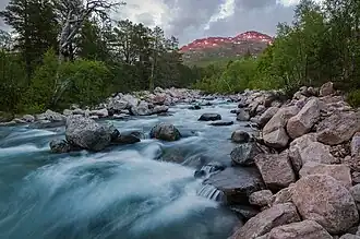 Sunset by a river in the heart of Trollheimen mountains near Trollheimshytta