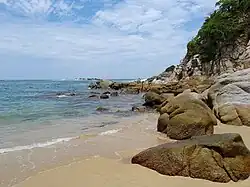 Rocks fringe the southern end of Arrocito Beach
