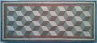 An ancient Roman geometric mosaic. The cubic texture induces a Necker-cube-like optical illusion.
