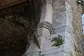 Northeast corbel. Square masons' marks are visible on the stones.
