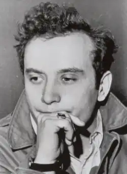 Black and white photo of Frankhouser holding his hand to his chin