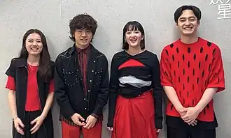 Ryokuoushoku Shakai on SET News in 2023 From left to right: Peppe, Shingo Anami, Haruko Nagaya, and Issei Kobayashi