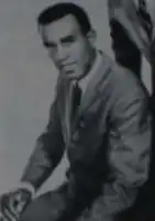 A singer wearing a suit