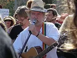 Tommy Sands performs in a joint Israeli-Palestinian demonstration in Sheikh Jarrah against house evictions of Palestinians by Israeli courts.