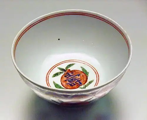 Cup with symbol within peach