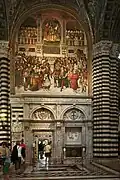 Piccolomini Library portal by Lorenzo di Mariano (1497). Above the Papal Coronation of Pius III by Pinturicchio in 1504.