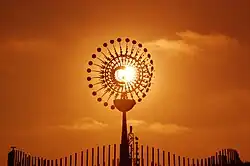 The Sun and the public cauldron at Candelária Square.