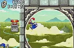 Screenshot showing Sonic running around a loop in Angel Island zone, the game's fifth level. The HUD on the upper left-hand corner shows the timer, score, and amount of rings the player has.