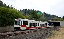 a Red Line train exiting a tunnel