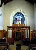 The former rood screen is at the church's west end