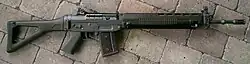 SIG SG 550 assault rifle, laying on the ground oriented right