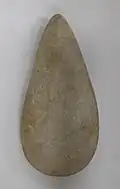 Stone celt (knife), used to peel and cut the cassava