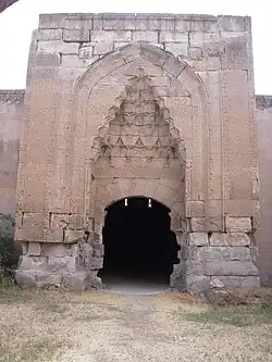 A large stone gate with stone-carved decoration