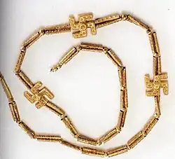 A swastika necklace excavated from Marlik, Gilan province, northern Iran, circa 1,200–1,050 BCE