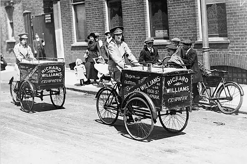 Two couriers making deliveries with cargo bikes, July 1915
