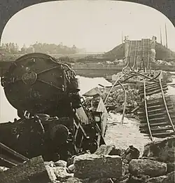 B&W photo of a train in a river
