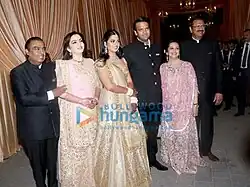 The Ambani and Piramal at the wedding reception of Isha Ambani-Anand Piramal (from left to right:-[[Mukesh Ambani]], [[Nita Ambani]], Isha Ambani, Anand Piramal, [[Swati Piramal]], Ajay Piramal