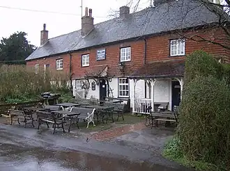 Tiled public house with porches and external tables