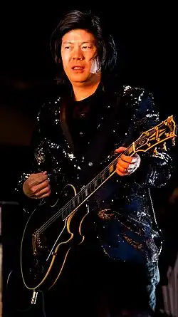 Iha with The Smashing Pumpkins in 2019.