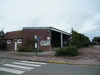 The town hall and school in Thieulloy-l'Abbaye