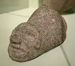 Three-pointed sculpture with carved face c. 1000-1494 CE