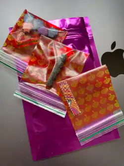 From top to bottom: 2C-B pills, 4-HO-MET set in gelatine, and a strip of LSD tabs