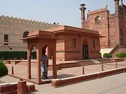 Iqbal's mausoleum adjacent to the Badshahi Mosque's gateway