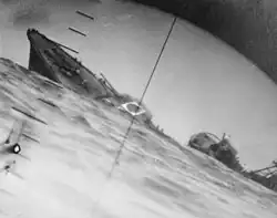 Torpedoed Japanese destroyer Yamakaze photographed through periscope of USS Nautilus, 25 June 1942.