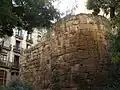 Rounded corner tower of the walls at the Plaça dels Traginers