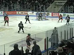 In-game hockey action at a pee-wee tournament
