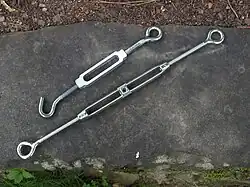 Top: lower quality aluminum bolt and hook turnbuckle; bottom: higher quality cast stainless steel turnbuckle