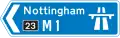 Direction to a motorway at the junction shown, indicating route number and destination reached